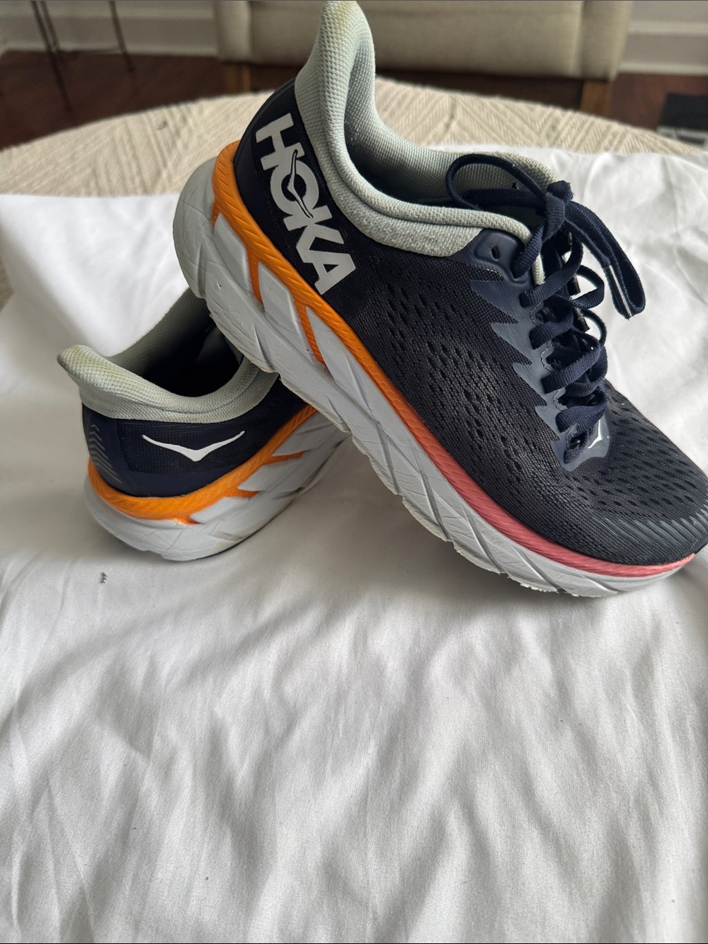Hoka women’s Running Shoes in Navy, Light Gray and Coral